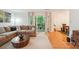 Comfortable living room showcasing hardwood floors, a plush sofa, and natural light at 1445 Monroe Ne Dr # A12, Atlanta, GA 30324