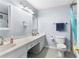 Bright bathroom featuring a dual vanity and tiled shower at 3261 Hidden Forest Dr, Snellville, GA 30078