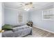 Relaxing bedroom featuring one window, ceiling fan, and light colored walls at 3261 Hidden Forest Dr, Snellville, GA 30078