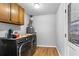 Functional laundry room equipped with washer, dryer, and utility sink at 3261 Hidden Forest Dr, Snellville, GA 30078