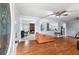 Open-concept living room with hardwood floors and views into the dining and living spaces at 3261 Hidden Forest Dr, Snellville, GA 30078
