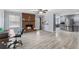 Spacious living area with a cozy brick fireplace, light-colored flooring and updated kitchen at 3261 Hidden Forest Dr, Snellville, GA 30078