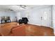 Comfortable living room with hardwood floors, featuring a front door view and ample natural light at 3261 Hidden Forest Dr, Snellville, GA 30078