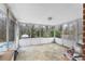 Enclosed sunroom provides natural light and views of backyard at 3261 Hidden Forest Dr, Snellville, GA 30078