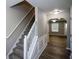 The front foyer showcases hardwood flooring and a staircase leading to the upper level at 5592 Bluegrass Dr, Atlanta, GA 30349