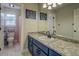 Bathroom with modern blue vanity and gray countertops at 20 Alison Trail, Covington, GA 30014