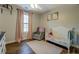 Bedroom featuring hardwood floors, ceiling fan, and window at 20 Alison Trail, Covington, GA 30014