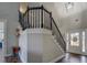 Elegant entryway with wood floors, staircase, and ample natural light at 20 Alison Trail, Covington, GA 30014