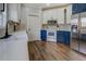 This kitchen features stainless steel appliances, two-toned cabinets, and a tiled backsplash at 20 Alison Trail, Covington, GA 30014