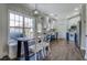 Bright kitchen featuring a breakfast nook, stainless steel appliances, white cabinets and a large window at 20 Alison Trail, Covington, GA 30014