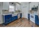 Stylish kitchen with two-tone cabinets, stainless appliances, and hardwood flooring, perfect for cooking and entertaining at 20 Alison Trail, Covington, GA 30014
