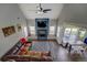 Open living room boasts a cozy fireplace, high ceilings, and plenty of natural light at 20 Alison Trail, Covington, GA 30014