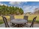 Outdoor patio area with seating and view of backyard at 20 Alison Trail, Covington, GA 30014