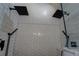 Walk-in shower featuring dual shower heads and herringbone tile at 20 Alison Trail, Covington, GA 30014