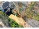 Aerial view of a home with a large backyard, patio, mature trees and professional landscaping at 3150 Shumard Way, Marietta, GA 30064