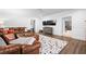 Finished basement with a large TV, brown leather sofa, and colorful rug at 3150 Shumard Way, Marietta, GA 30064