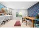 Craft room with colorful floral wallpaper and natural light from the window at 3150 Shumard Way, Marietta, GA 30064