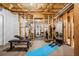 Unfinished basement gym with exposed wood framing and fitness equipment at 3150 Shumard Way, Marietta, GA 30064