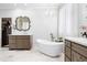 Luxurious bathroom featuring a standalone tub, dual vanities, and elegant lighting at 3150 Shumard Way, Marietta, GA 30064