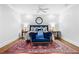 Cozy bedroom with a comfortable bed, decorative pillows, and a vibrant rug at 3150 Shumard Way, Marietta, GA 30064