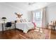 Well-lit bedroom featuring hardwood floors, area rug and furnishings at 3150 Shumard Way, Marietta, GA 30064