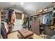 Walk-in closet features built-in storage and an ottoman at 3150 Shumard Way, Marietta, GA 30064