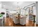 Open dining area featuring stainless appliances, and views of living area with stone fireplace at 3150 Shumard Way, Marietta, GA 30064