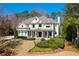 Stately home featuring a manicured front lawn and a charming front porch with classic white columns at 3150 Shumard Way, Marietta, GA 30064