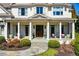Inviting porch with white columns, a stone path, and greenery that enhances curb appeal at 3150 Shumard Way, Marietta, GA 30064