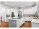 Modern kitchen featuring stainless steel appliances, an island, and bright white cabinetry at 3150 Shumard Way, Marietta, GA 30064