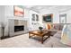 Cozy living area featuring a stone fireplace, stylish decor, and comfortable seating at 3150 Shumard Way, Marietta, GA 30064