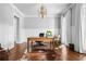 Home office featuring rich hardwood floors, wainscoting, and a traditional desk with a cozy rug at 3150 Shumard Way, Marietta, GA 30064