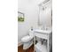 Elegant powder room featuring a pedestal sink, modern fixtures, and sophisticated decor at 3150 Shumard Way, Marietta, GA 30064