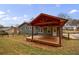 Backyard with a covered deck, a grey house, and a wooden fence at 3310 Forest Creek Sw Dr, Marietta, GA 30064