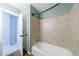 Bathroom with tub and shower with decorative tile, and wood flooring at 3310 Forest Creek Sw Dr, Marietta, GA 30064
