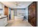 Elegant bathroom featuring a freestanding tub, modern vanity, and rustic barn door accent at 3310 Forest Creek Sw Dr, Marietta, GA 30064