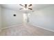 A spacious bedroom with neutral carpet and a ceiling fan at 3310 Forest Creek Sw Dr, Marietta, GA 30064