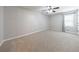 Spacious carpeted bedroom with natural light and ceiling fan at 3310 Forest Creek Sw Dr, Marietta, GA 30064