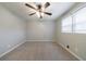 A spacious bedroom with neutral carpet, a ceiling fan and a double window at 3310 Forest Creek Sw Dr, Marietta, GA 30064