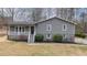 Charming two-story home featuring gray siding, a cozy front porch and well-maintained landscaping at 3310 Forest Creek Sw Dr, Marietta, GA 30064