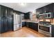 Modern kitchen with stainless steel appliances, granite countertops, and ample storage space at 3310 Forest Creek Sw Dr, Marietta, GA 30064