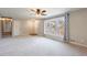 Spacious living room featuring a large window and carpet at 3310 Forest Creek Sw Dr, Marietta, GA 30064