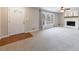 Living room with fireplace, large window, and neutral carpet at 3310 Forest Creek Sw Dr, Marietta, GA 30064