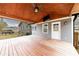 Covered patio with wood ceiling, fan, and a view of the backyard at 3310 Forest Creek Sw Dr, Marietta, GA 30064