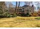Spacious backyard with mature landscaping and large trees, perfect for outdoor entertaining at 656 Gunby Se Rd, Marietta, GA 30067