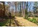Lush backyard featuring a stone path and manicured lawn, perfect for outdoor activities and relaxation at 656 Gunby Se Rd, Marietta, GA 30067