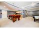 Basement space showcasing a pool table, bar area, and comfortable seating, perfect for entertaining at 656 Gunby Se Rd, Marietta, GA 30067