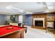 Basement space with a pool table, fireplace, and pinball machines, designed for endless entertainment at 656 Gunby Se Rd, Marietta, GA 30067