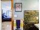 Bathroom featuring a slate accent wall, open doorway to the main bedroom, and a towel rack at 656 Gunby Se Rd, Marietta, GA 30067