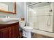 Bathroom with a modern vanity, toilet, and glass-enclosed shower at 656 Gunby Se Rd, Marietta, GA 30067